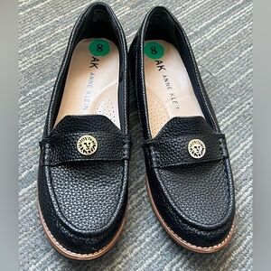 Anne Klein black loafers with medallion